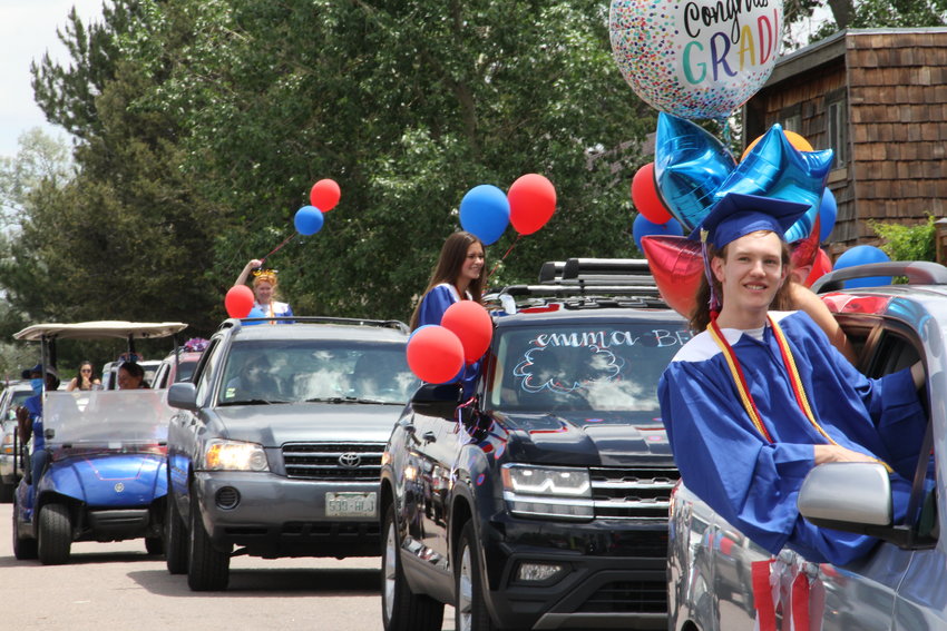 Hundreds of cars — many with balloons, words and other decorations adorning them — drove slowly past Cherry Creek High's staff members, who cheered them on.